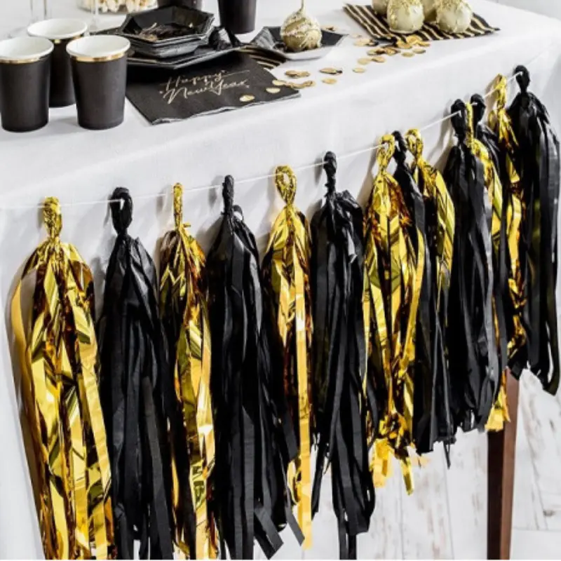 Guirlande pompons or et noir